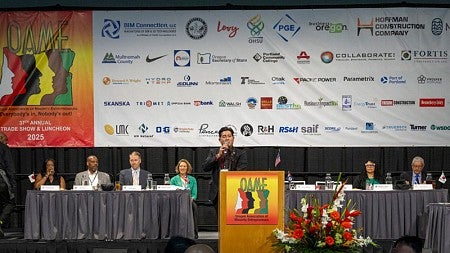OAME presenter speaking from podium at annual OAME 2025 Conference.