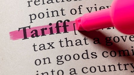 Highlighter highlighting the word Tariff in a block of definition text.