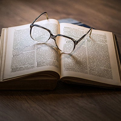 Open book with glasses Open book with glasses